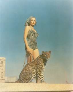 Gene Tierney on the set of The Egyptian, 1954  with feline friend