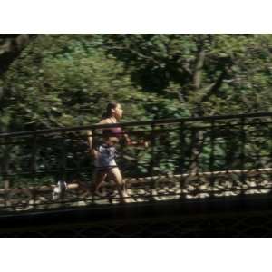 Hispanic Woman Running for Exercise, New York, New York, USA Stretched 
