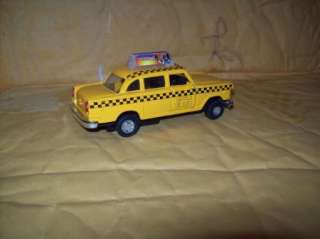   40 SCALE NEW YORK YELLOW CHECKER CAB FRICTION CAR 2 DOORS OPEN  
