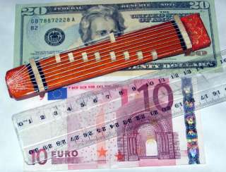 Currency and centimeter ruler shown to indicate size   not included.