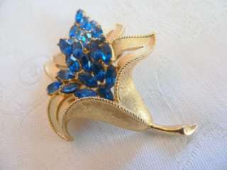 Crown Trifari goldtone flower brooch with marquise Montana Blue 