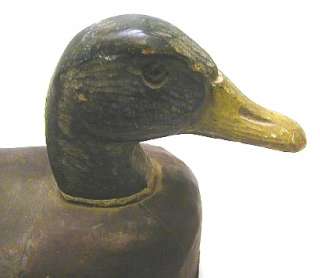 Pair of vintage carved wood, canvas and cork duck decoys. Circa 1920s 