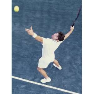  High Angle View of Man Serving a Tennis Ball Premium 